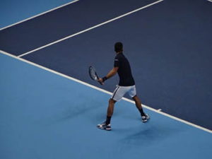 Novak Djokovic on a hard tennis court